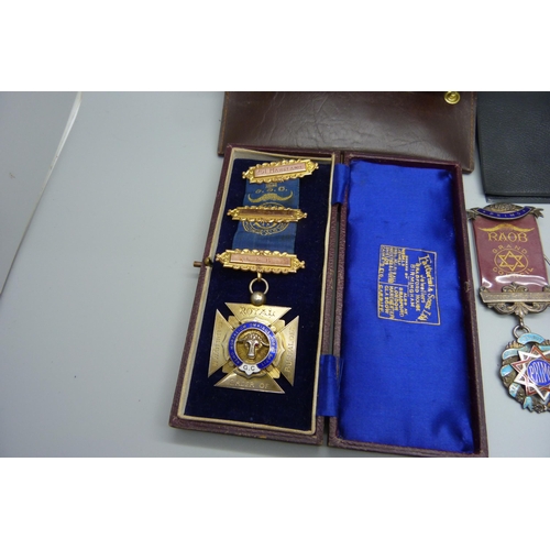 828 - Four silver lodge medals, one with three 9ct gold bars