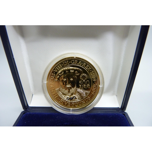 831 - Two silver coins; HRH Prince George of Cambridge first birthday commemorative coin and a gold plated... 