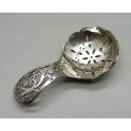 841 - A pierced silver caddy spoon, Sheffield 1938, 26g