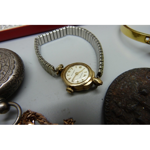 853 - A lady's 9ct gold wristwatch, a 9ct gold bracelet, 4.7g, a silver and gold stone ring, a silver fob ... 