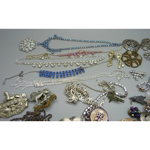 858 - Assorted jewellery including paste, 1970's stainless steel, military badges, etc.