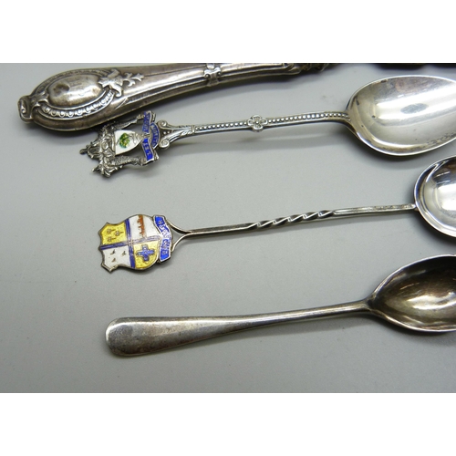 883 - Four silver spoons and a Victorian silver butter knife, 76g