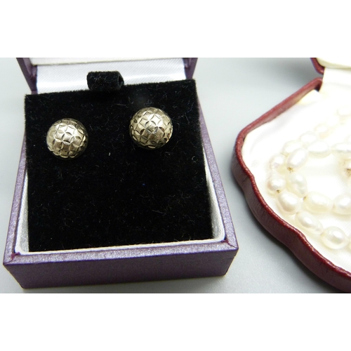 906 - A pair of 9ct white gold earrings and a string of pearls with 14ct gold fastener