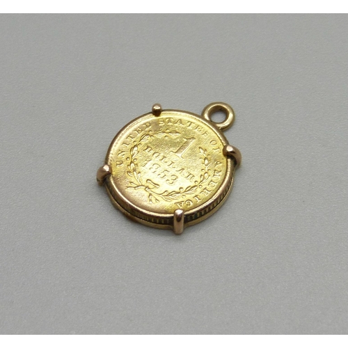 913 - A 9ct gold one dollar coin mounted, weight of coin 1.67g, gold content .900, 1853, mount tests as go... 