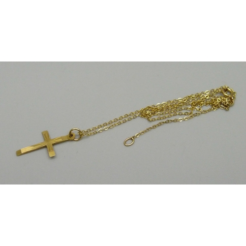 915 - A 9ct gold cross and chain, 1.4g