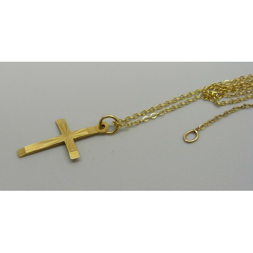 915 - A 9ct gold cross and chain, 1.4g