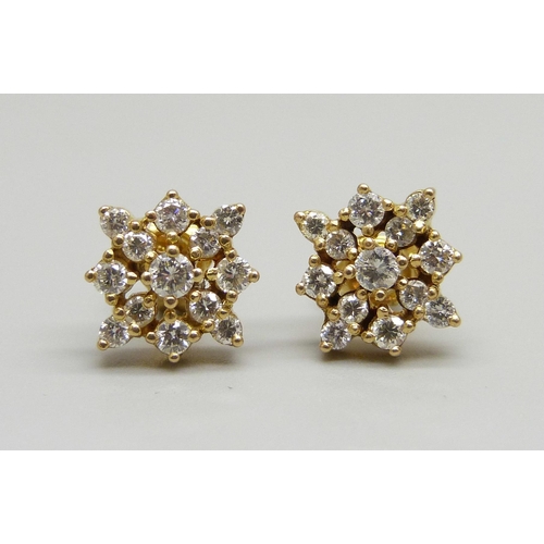 924 - A pair of 18ct gold and diamond earrings, 3.4g