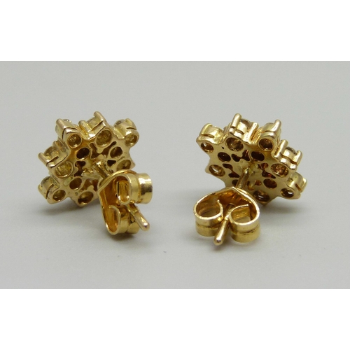 924 - A pair of 18ct gold and diamond earrings, 3.4g