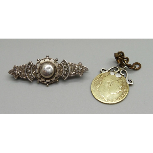 928 - A Victorian silver brooch and silver gilt coin pendant