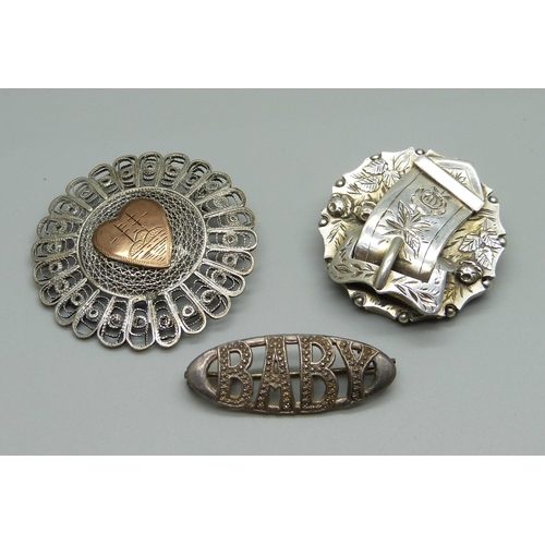 929 - A silver 'Baby' brooch, a Victorian silver buckle brooch and a filigree brooch lacking pin