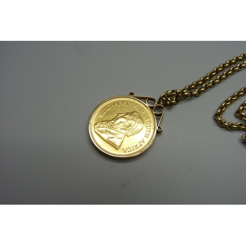 945 - A 1980 1oz. fine gold Krugerrand in a 9ct gold mount and on a 9ct gold chain, total weight 56.3g