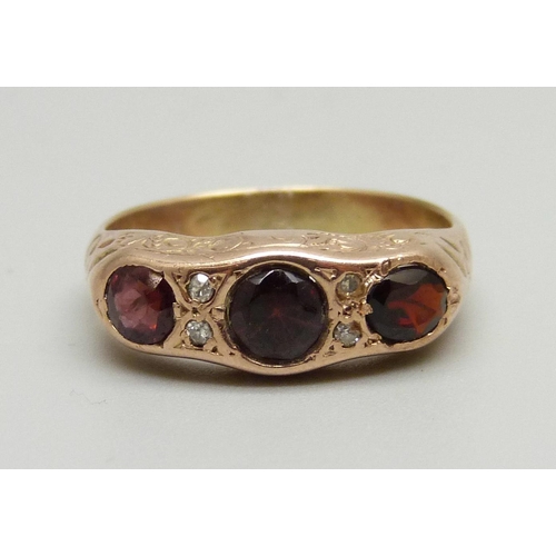 948 - A yellow metal, garnet and diamond ring, 3.7g, N