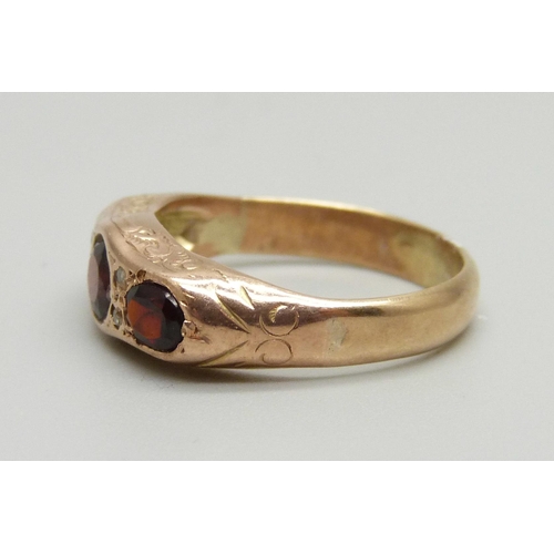 948 - A yellow metal, garnet and diamond ring, 3.7g, N