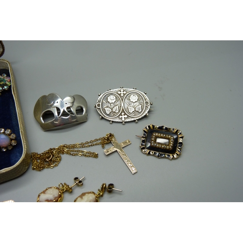 968 - Jewellery including a silver elephant brooch, a Victorian silver brooch, yellow metal mourning brooc... 