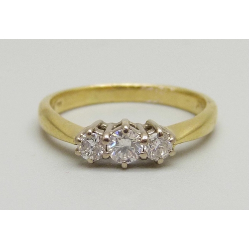 971 - An 18ct gold three stone diamond ring, 2.4g, J