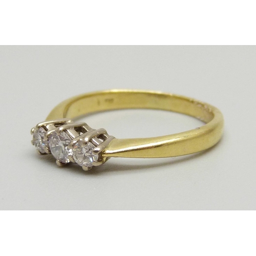 971 - An 18ct gold three stone diamond ring, 2.4g, J