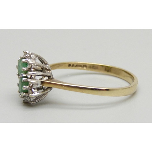 975 - A 9ct gold, emerald and diamond double cluster ring, 1.7g, N