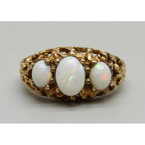 977 - A 9ct gold and opal ring, 3.7g, N