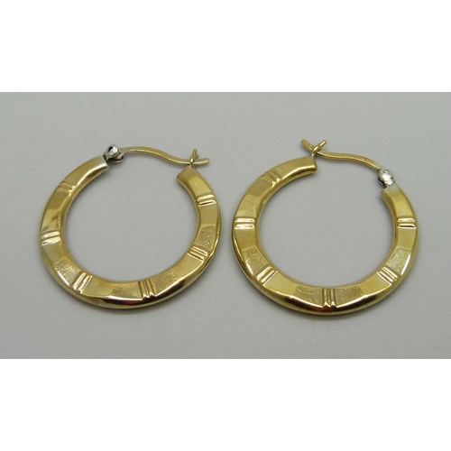 980 - A pair of silver gilt hoop earrings