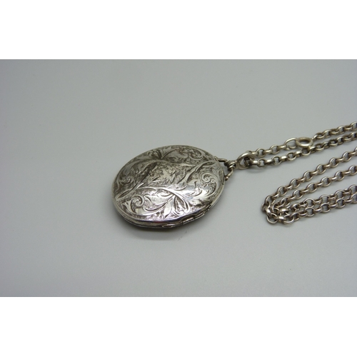 984 - A Victorian silver locket on a silver chain, Birmingham 1882, 23g