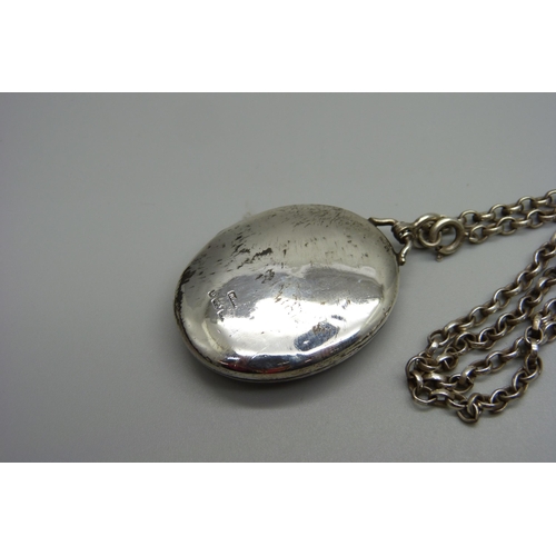 984 - A Victorian silver locket on a silver chain, Birmingham 1882, 23g