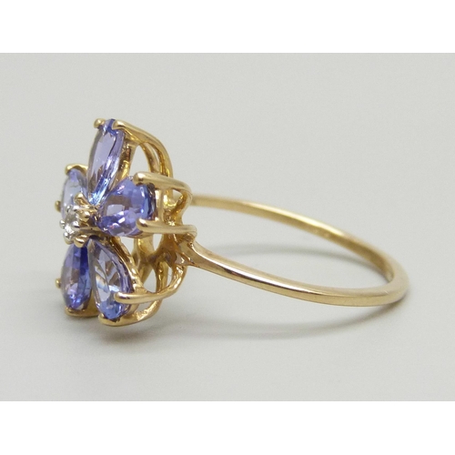 990 - A 9ct gold and tanzanite cluster ring, 2.3g, N