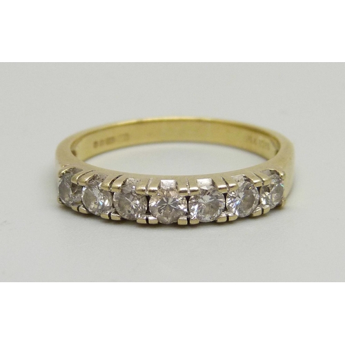 991 - An 18ct gold, seven stone diamond ring, approximately 0.50ct diamond weight, 3.8g, P