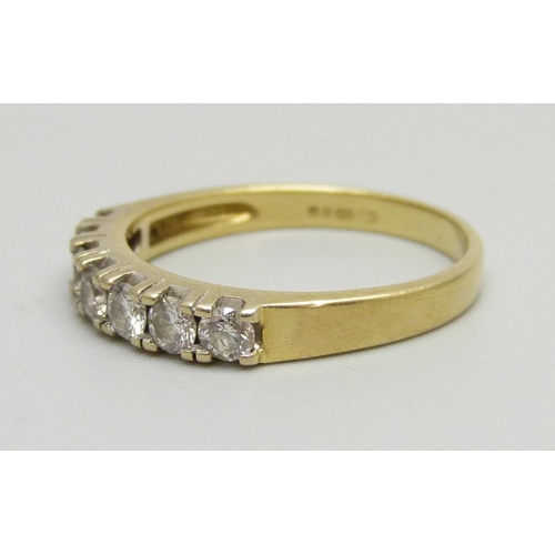 991 - An 18ct gold, seven stone diamond ring, approximately 0.50ct diamond weight, 3.8g, P