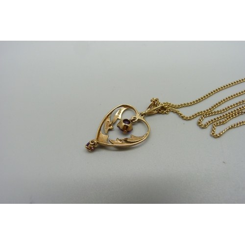 997 - A 9ct gold Art Nouveau style amethyst pendant on a chain, pendant 2.4g