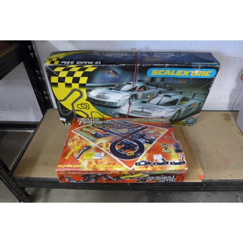 2057 - A Scalextric Le Mans 24 hr set in box with Micro Scalextric Transformers set in box