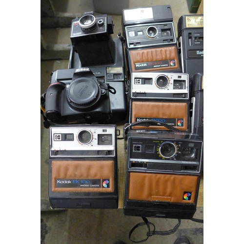 2060 - 2 Boxes of 35mm and instant cameras including Poloroid, Kodak, Nikon and more