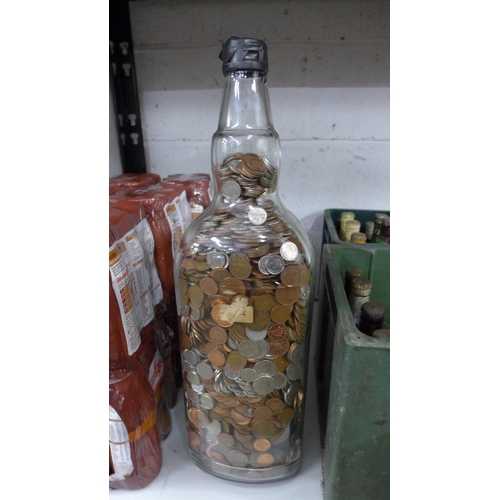 2073 - A Bells whisky bottle full of money