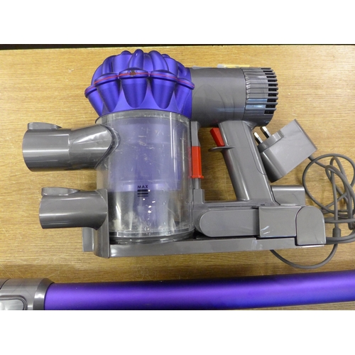 2121 - A Dyson V6 Animal vacuum cleaner with dock and charger