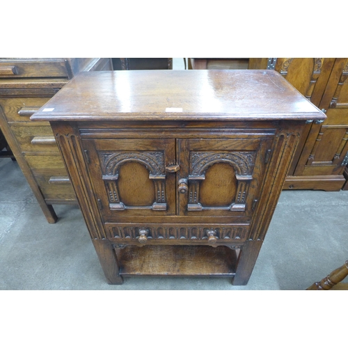 111 - A 17th Century style carved oak credence cupboard