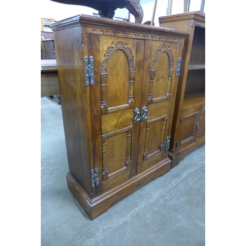 112 - A 17th Century style carved oak credence cupboard