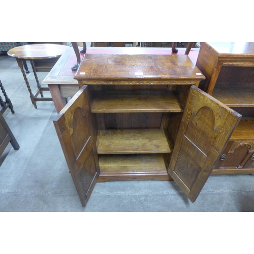 112 - A 17th Century style carved oak credence cupboard