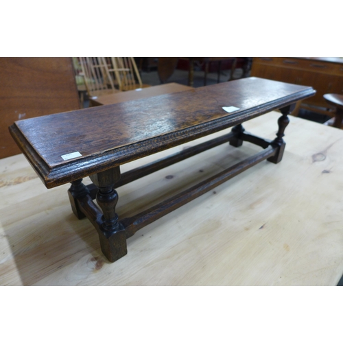 123 - A miniature oak bench