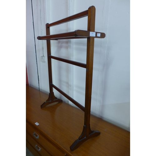 124 - An Arts and Crafts mahogany towel rail