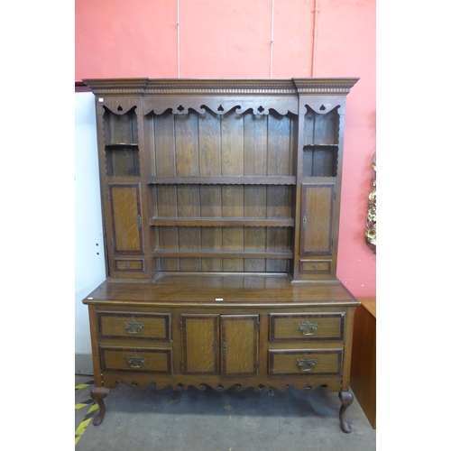 128 - A George II style inlaid oak dresser