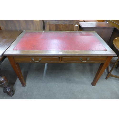 136 - An Edward VII mahogany and red leather topped two drawer writing table