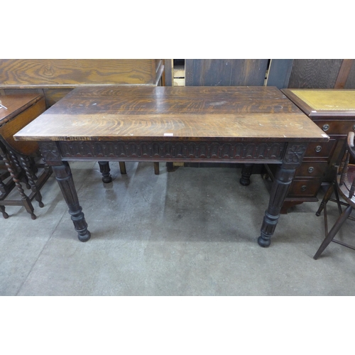 137 - An 19th Century carved oak serving table