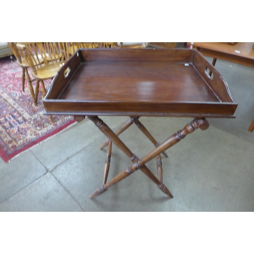 14 - A Victorian style mahogany butler's tray on folding stand