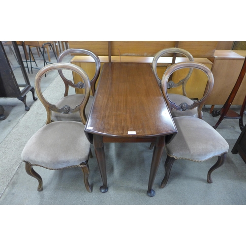 147 - A George II mahogany gateleg table and a set of four Victorian walnut balloon back chairs