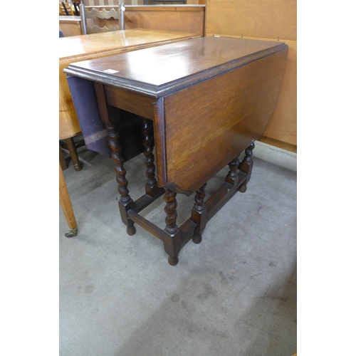 148 - An early 20th Century oak barleytwist gateleg table