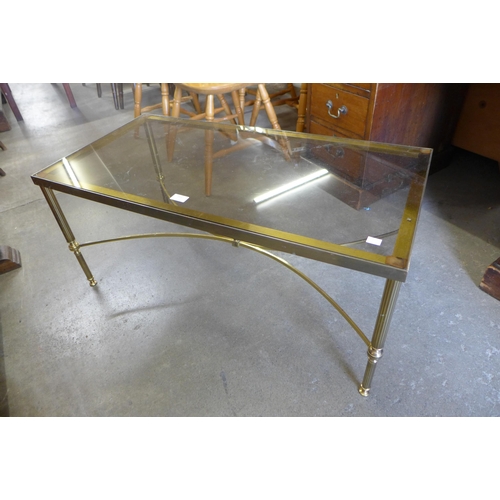 153 - An Italian glass topped brass rectangular coffee table