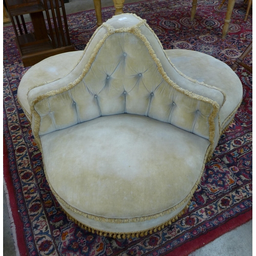 16 - A Victorian fabric upholstered three seater conversation seat