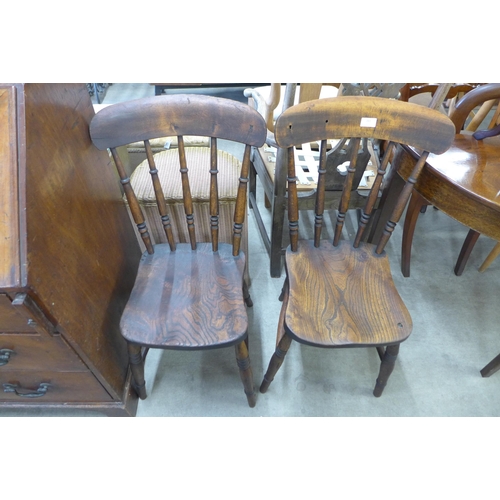 161 - A pair of Victorian elm and beech kitchen chairs