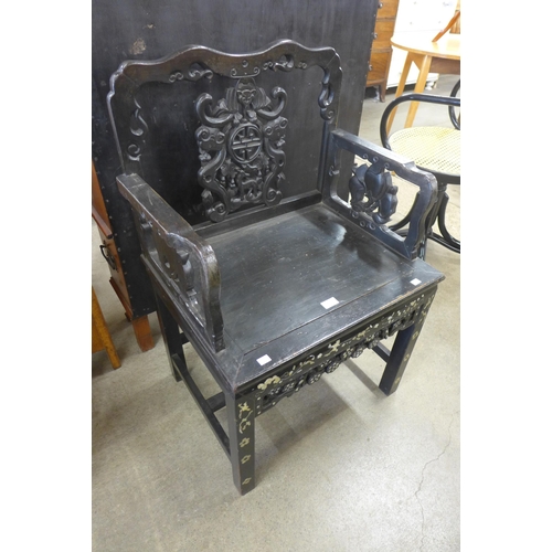 166 - A Chinese carved ebonised and mother of pearl inlaid armchair