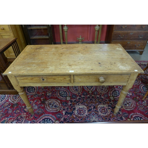 17 - A Victorian waxed pine two drawer kitchen table