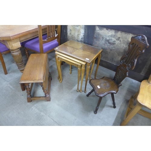 175 - An oak gateleg occasional table, a spinning stool and a walnut nest of tables